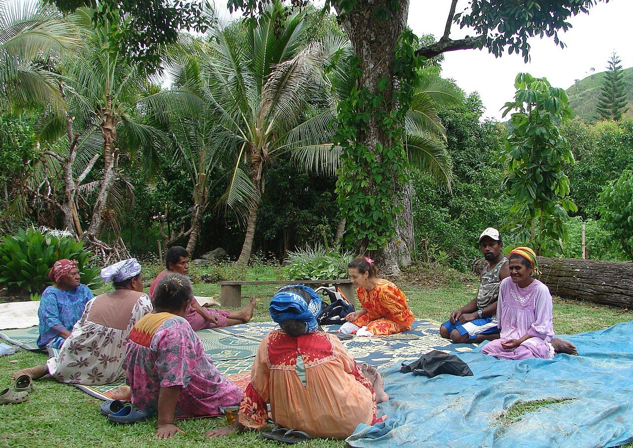 An anthropologist and community members working together on a shared research project