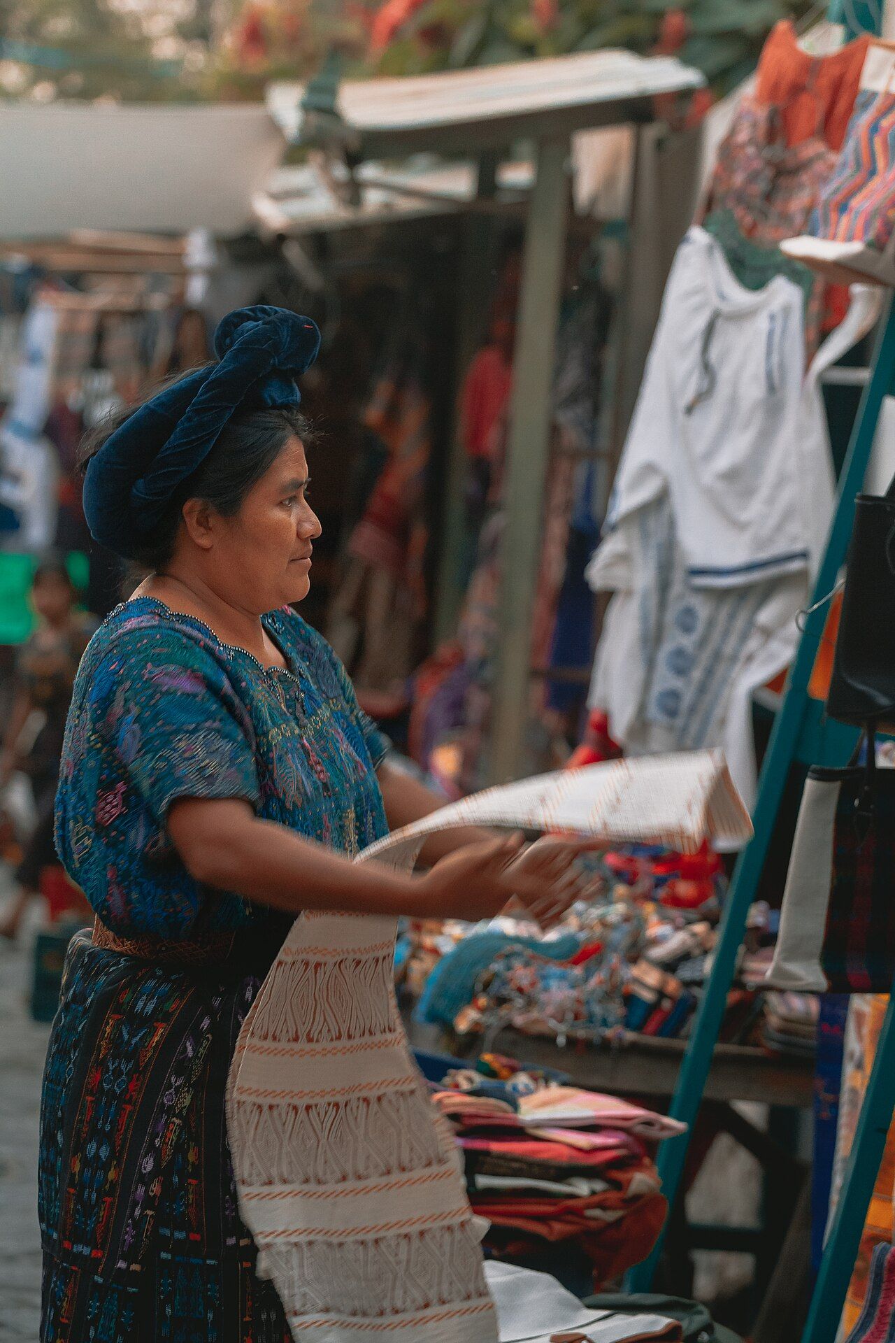 A street vendor selling goods in a Guatemalan market