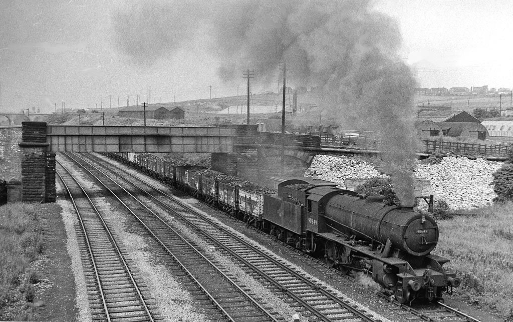 Railway junction with a set of points and diverging tracks, viewed along the rails