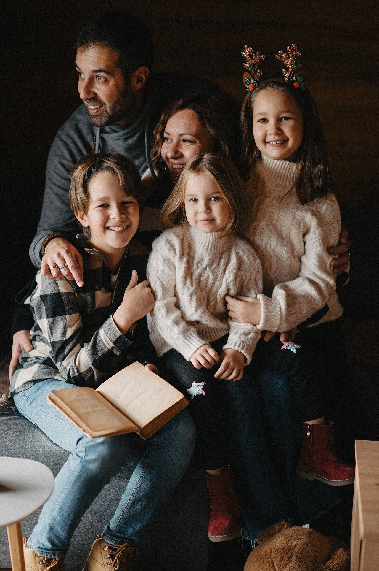 A family gathered together at home sharing a warm moment