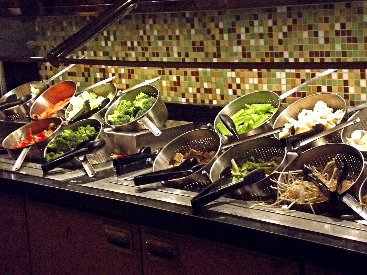 Prepared dishes displayed along a buffet service line