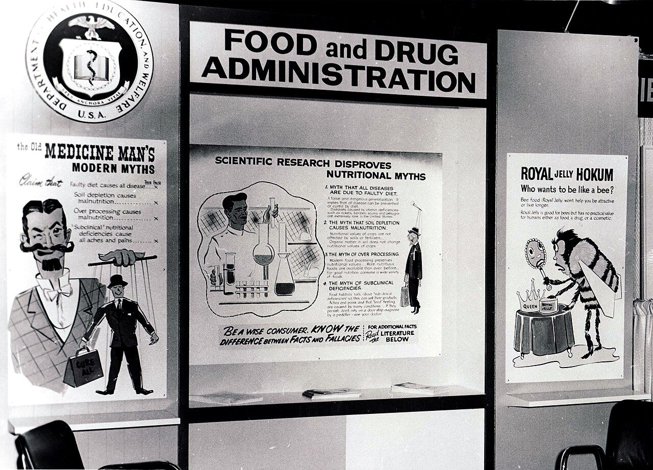 A historical public exhibit displaying examples of fraudulent nutrition products and devices