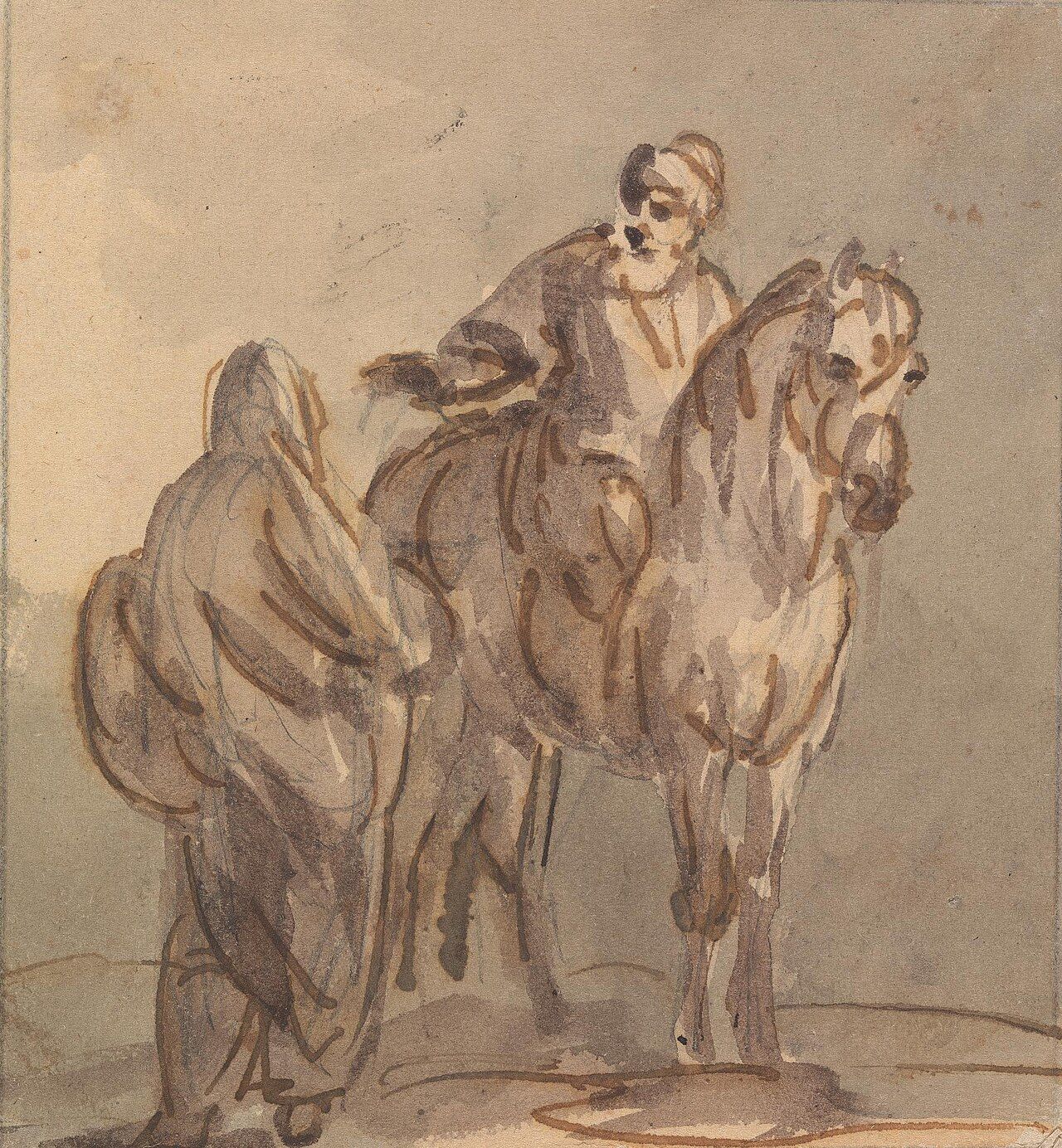 Two people seated at a small table in conversation, one leaning slightly forward with an open posture while the other speaks and gestures.