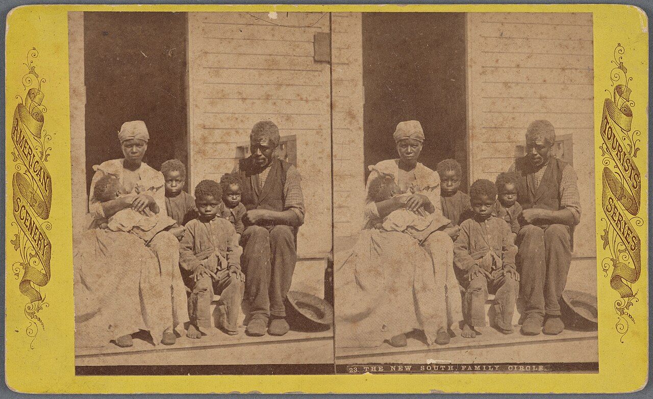 A family gathered together on a porch, an example of a small, close primary group