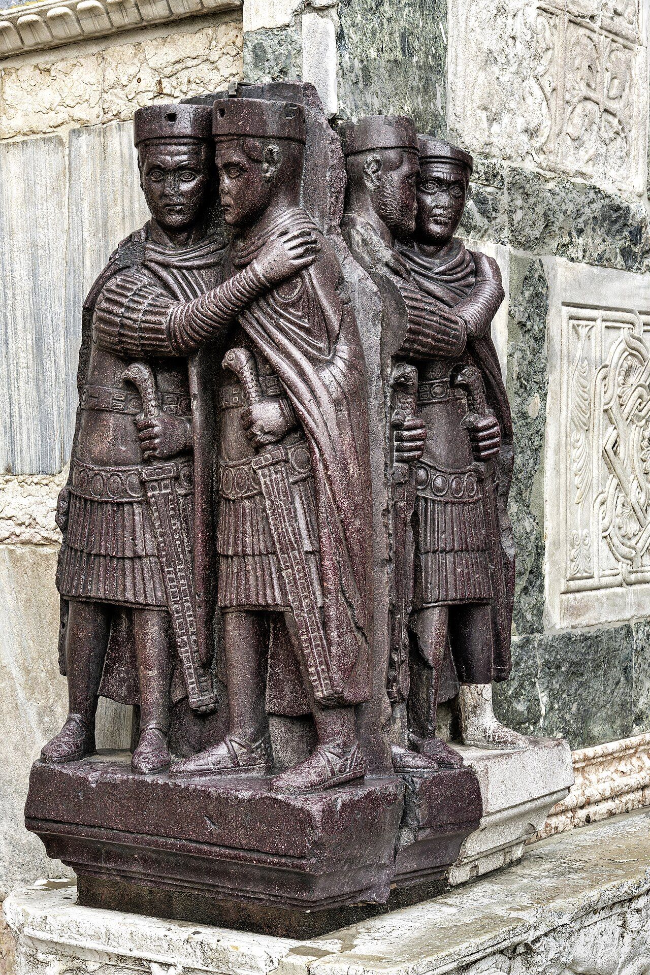 Porphyry sculpture of four embracing tetrarchs in identical military dress, set into a corner of St. Mark's Basilica in Venice